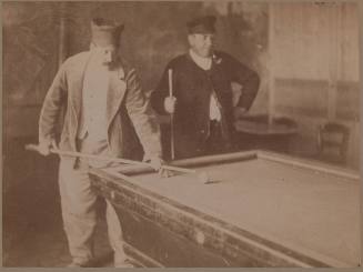 Two Men Playing Billiards